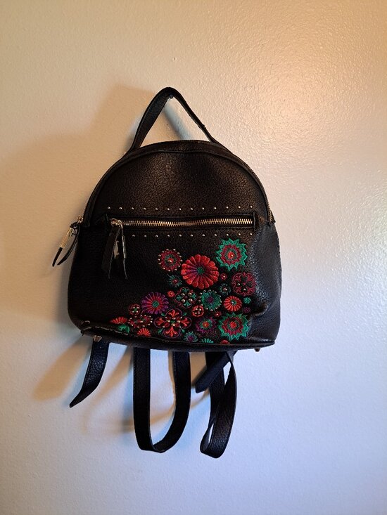 Steve Madden Handbags - Black Steve Madden embroidered floral backpack with gold hardware.
